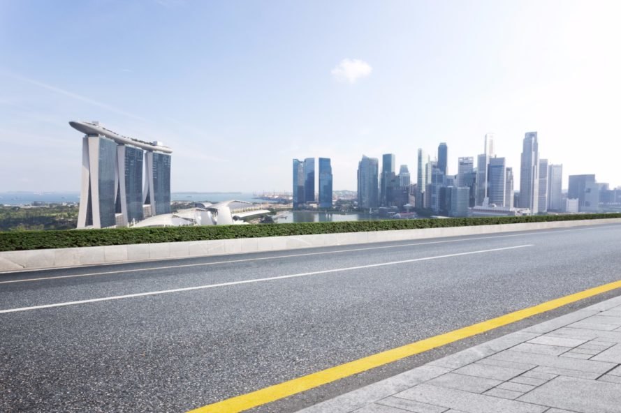 A view of a road, with Singapore in the background